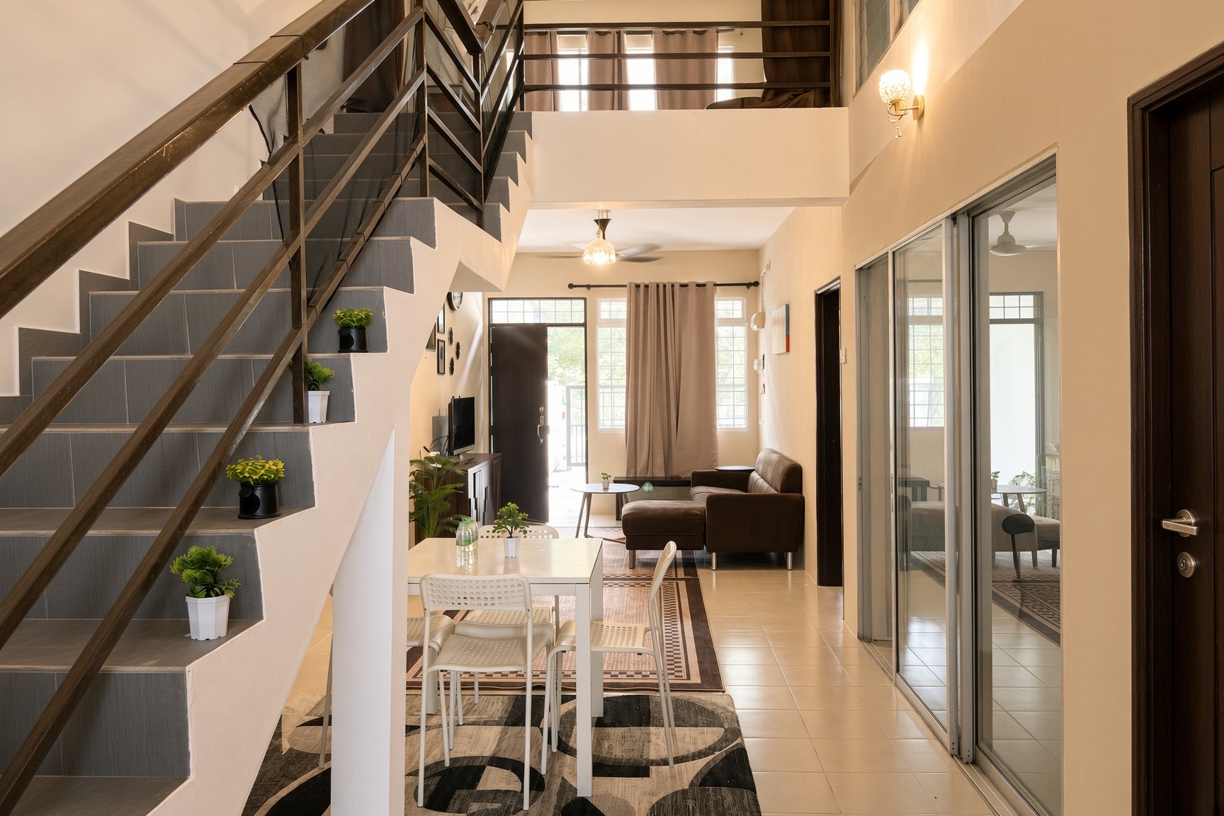 Open-plan dining and living area of a family homestay in Kuantan