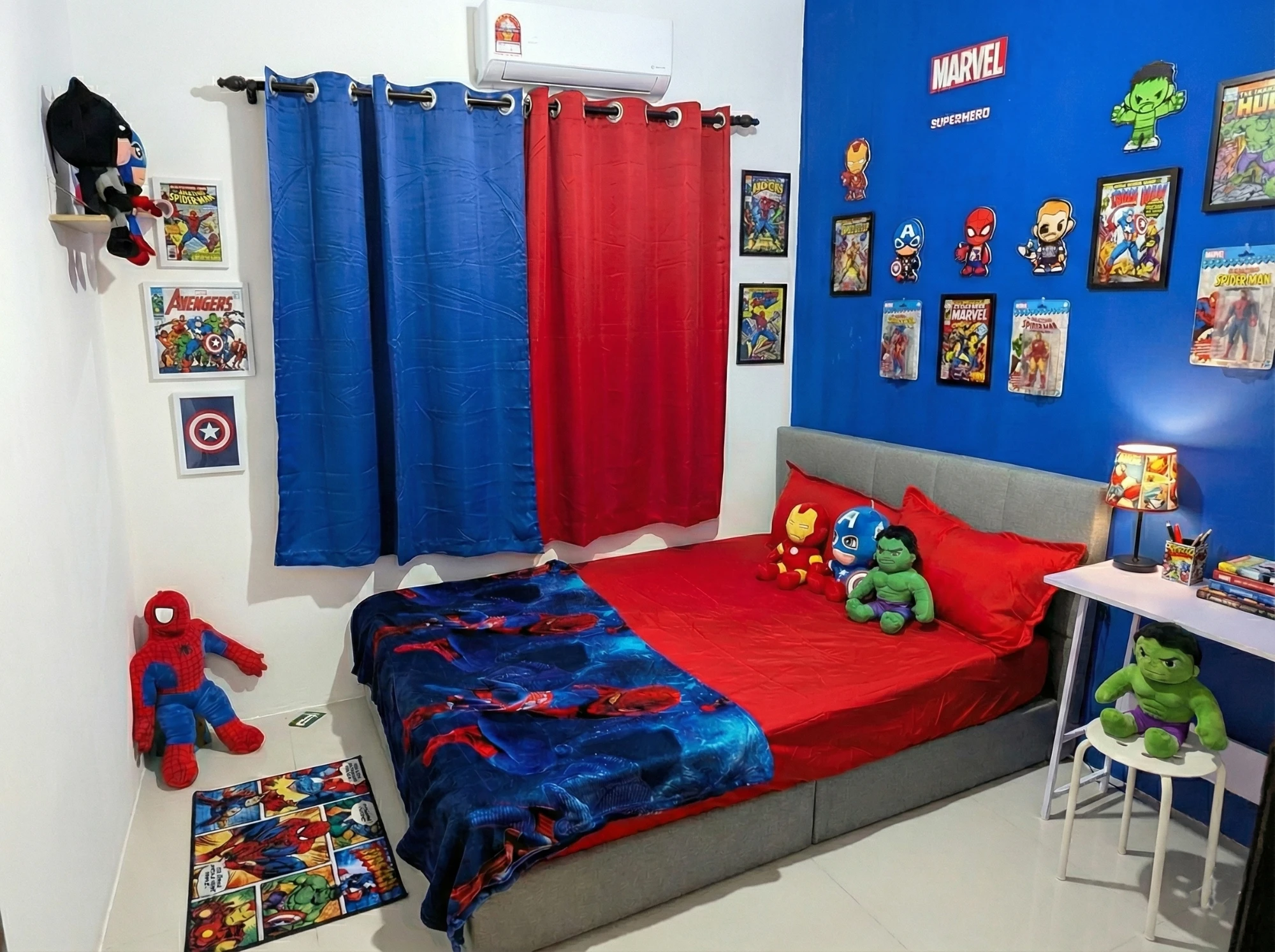 Superhero themed kids bedroom with comic wall and hero plush toys at Aydan Wonderland Homestay Kuantan